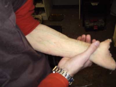 Fake arm for hair removal gag